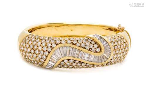 An 18 Karat Yellow Gold and Diamond Bangle Bracelet,