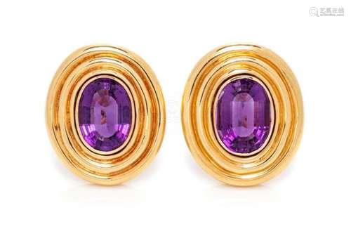 A Pair of 14 Karat Yellow Gold and Amethyst Earclips,