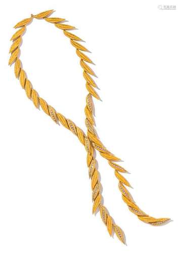 An 18 Karat Yellow Gold and Diamond Leaf Motif Lariat