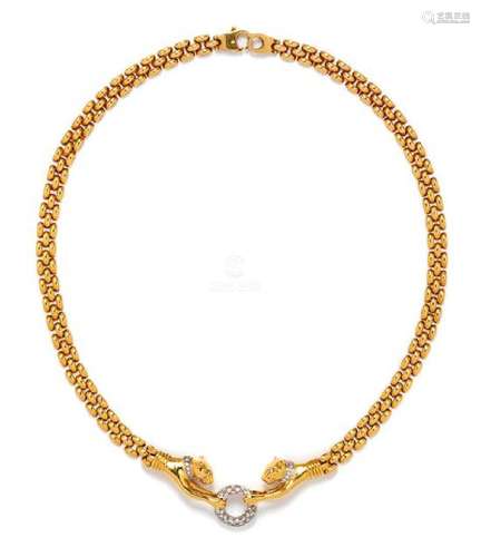 * An 18 Karat Bicolor Gold and Diamond Panther Motif