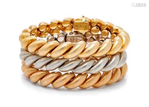 * A Collection of 18 Karat Gold Bracelets, Carlo