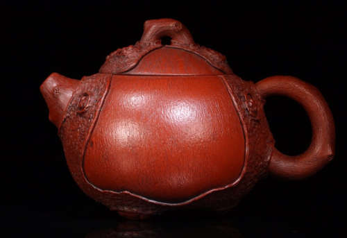 A ZISHA TEAPOT WITH TREE PATTERN BODY