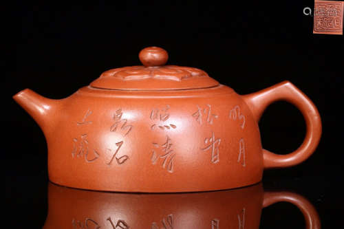 A ZISHA TEPOT WITH CHINESE CHARACTERS