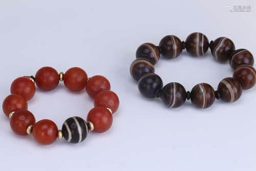 TWO CHINESE AGATE BEAD BUDDHIST BANGLES