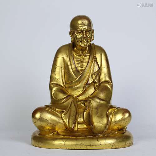 A Chinese Carved Gilt Wood Buddha