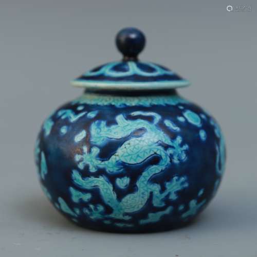 A Chinese Blue And White Porcelain Jar With Dragon Figures