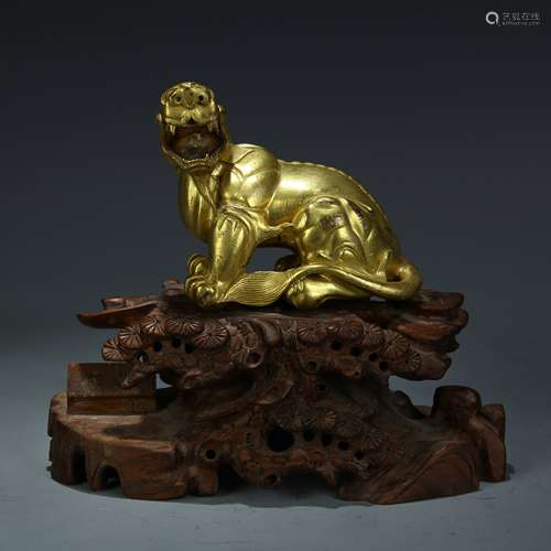 A Chinese Gilt Bronze Tiger with Rosewood Stand