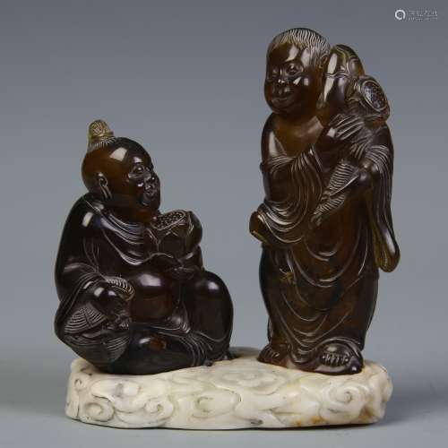 A Set of Two Chinese Carved Amber Figures