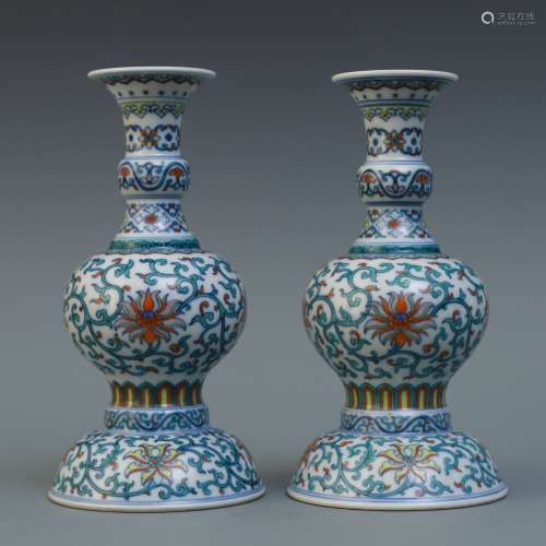 A Pair Of Chinese Famille-Rose Candle Holders
