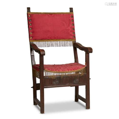 A SPANISH CARVED WALNUT MONK'S CHAIR WITH SILK DAMASK UPHOLSTERY