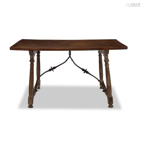 A SPANISH BAROQUE IRON-SPRUNG WALNUT CENTER TABLE