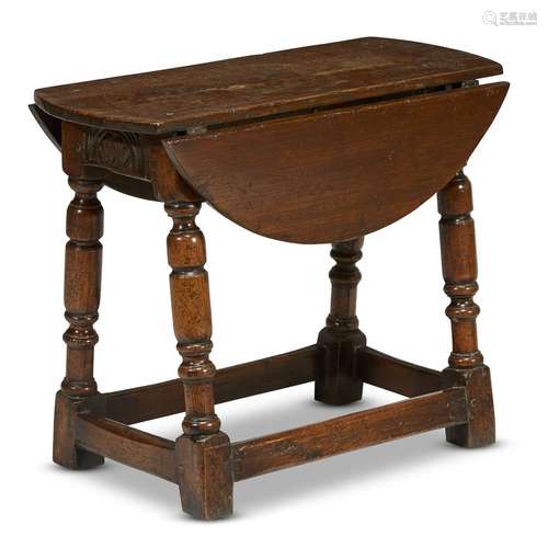 A MODIFIED JACOBEAN CARVED OAK JOINED STOOL