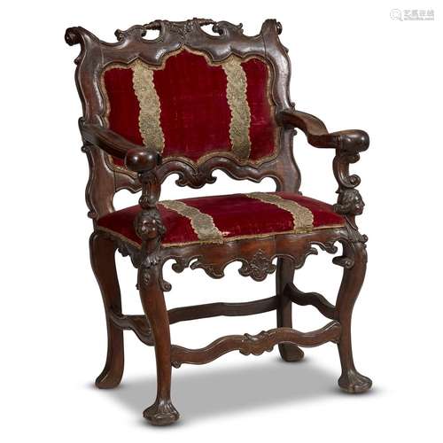 A PORTUGUESE ROCOCO CARVED WALNUT ARMCHAIR