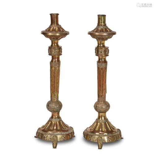 A PAIR OF MEXICAN COLONIAL GILT COPPER CANDLESTICKS