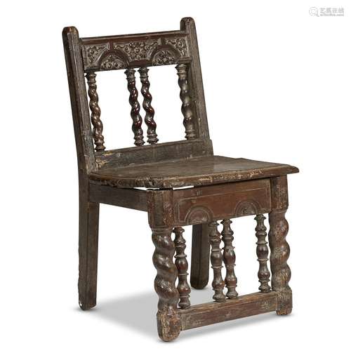 A SPANISH CARVED WALNUT CHILD'S CHAIR