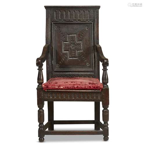 A JACOBEAN CARVED OAK WAINSCOT CHAIR