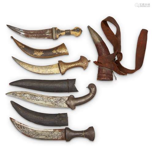 FOUR MUGHAL DAGGERS WITH SCABBARDS