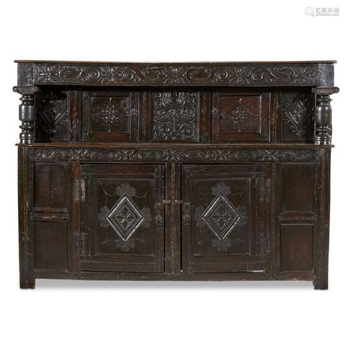 A LARGE AND FINE ELIZABETHAN/JAMES I CARVED OAK COURT CUPBOARD