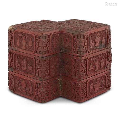 A CHINESE CARVED CINNABAR LACQUER 'DOUBLE LOZENGE' THREE-TIER BOX