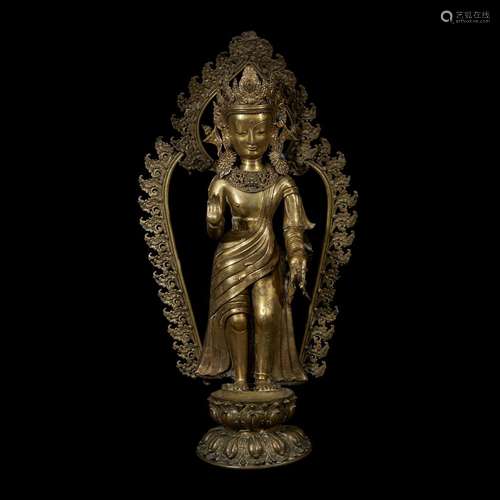 A LARGE NEPALESE GILT REPOUSSÉ AND CAST BRASS FIGURE OF A STANDING BODHISATTVA