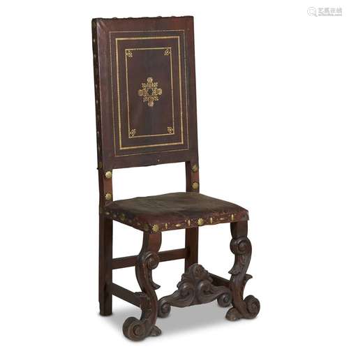 A SPANISH BAROQUE STYLE HALL CHAIR WITH TOOLED LEATHER UPHOLSTERY