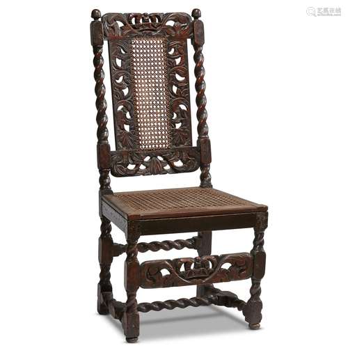 A WILLIAM & MARY CARVED WALNUT CANED SIDE CHAIR