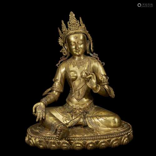 A NEPALESE REPOUSSÉ AND CAST GILT COPPER ALLOY FIGURE OF SEATED TARA