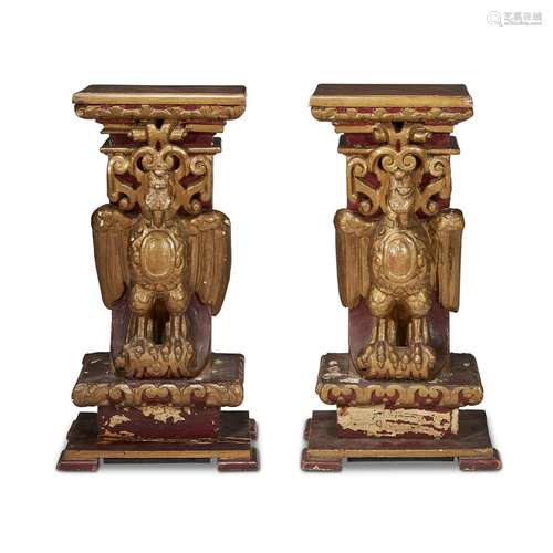 A PAIR OF MEXICAN PARCEL-GILT AND RED PAINTED EAGLE-FORM PEDESTALS