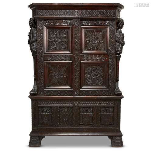 AN IMPRESSIVE HENRI IV BURGUNDIAN CARVED OAK LINEN PRESS