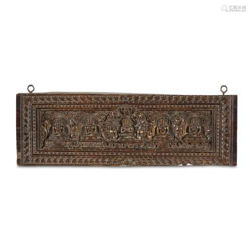 A SMALL TIBETAN CARVED WOOD AND PARCEL-GILT SUTRA COVER