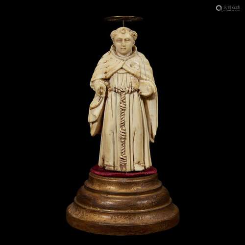 AN INDO-PORTUGUESE CARVED IVORY FIGURE OF ST. FRANCIS