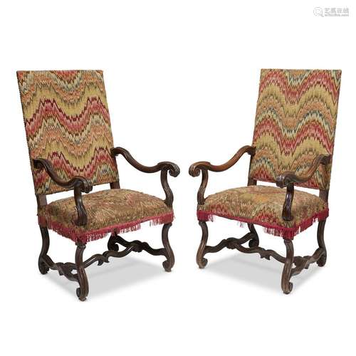 A PAIR OF SPANISH BAROQUE WALNUT ARMCHAIRS WITH FLAME STITCH UPHOLSTERY