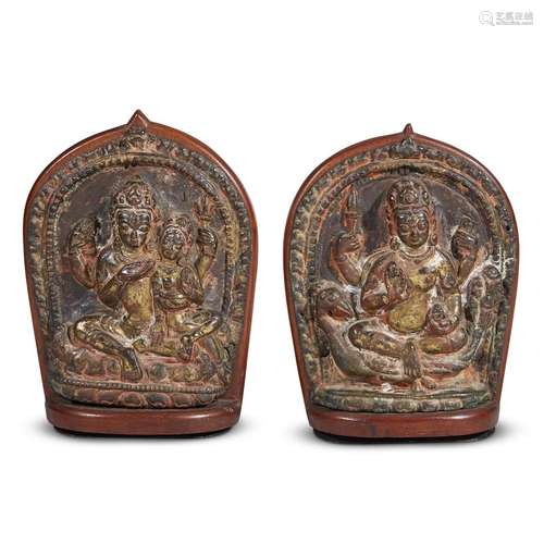 PAIR OF NEPALESE GILT BRASS REPOUSSÉ PLAQUES DEPICTING SHIVA WITH PARVATI (UMA-MAHESHVARA) AND KUMARA