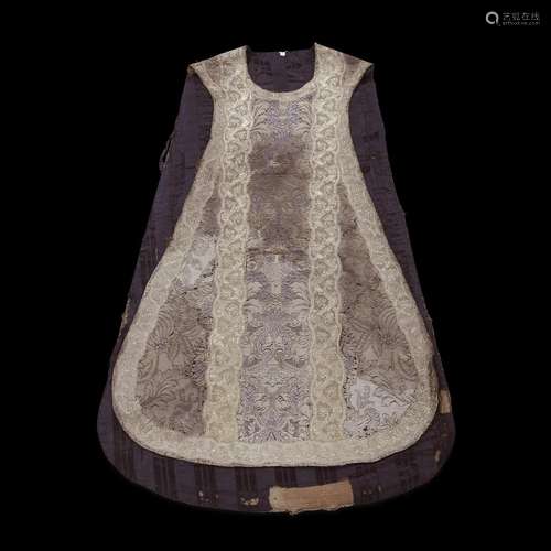 A FRENCH LACEWORK SILK CHASUBLE LINED IN BLACK STRIPED MOIRÉ SILK