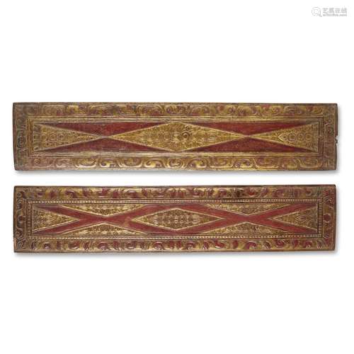 A PAIR OF TIBETAN CARVED, PARCEL GILT AND RED-LACQUERED WOOD SUTRA COVERS