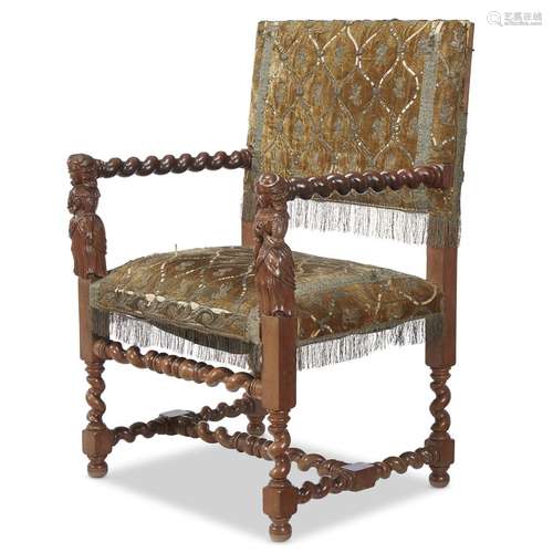 A JACOBEAN STYLE CARVED WALNUT ARMCHAIR WITH FIGURAL ARM RESTS