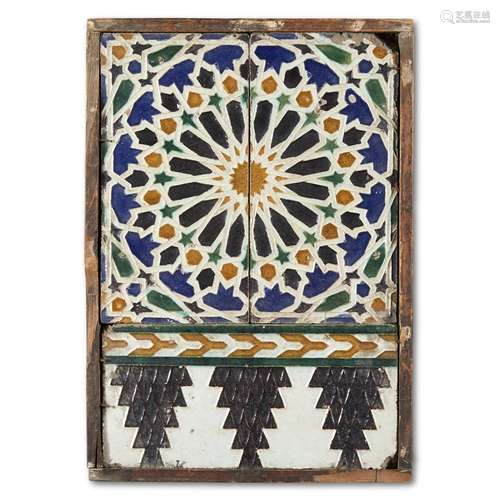 A HISPANO-MORESQUE CUENCA TIN-GLAZED EARTHENWARE TILE PANEL