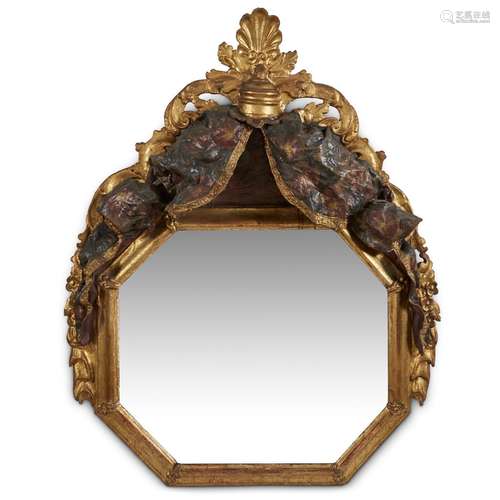 AN UNUSUAL PERUVIAN BAROQUE POLYCHROME GESSO AND CARVED GILTWOOD MIRROR