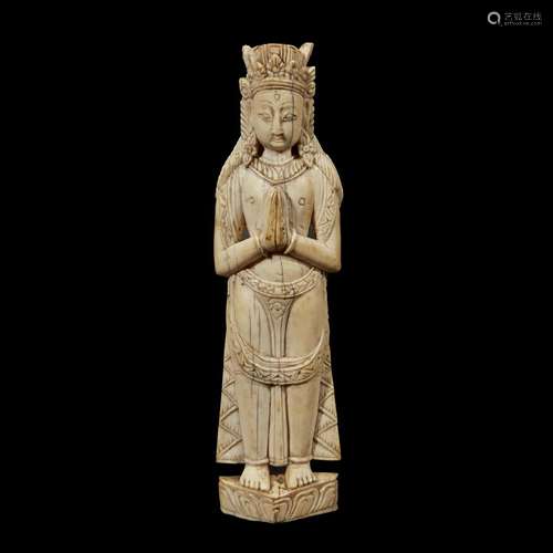 A CARVED IVORY FIGURE OF A BODHISATTVA STANDING, HAND IN ANJALI MUDRA