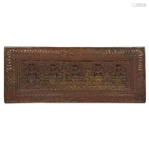 A TIBETAN CARVED WOOD AND PARCEL-GILT SUTRA COVER