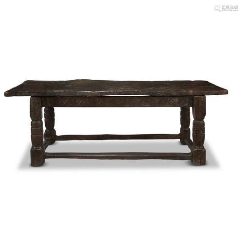 A TUDOR CARVED OAK REFECTORY TABLE WITH PLANK TOP