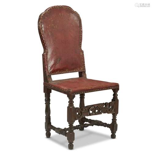 A SPANISH BAROQUE WALNUT LEATHER UPHOLSTERED SIDE CHAIR