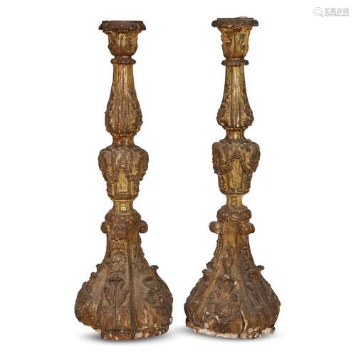 A PAIR OF SPANISH BAROQUE GILTWOOD CANDLESTICKS