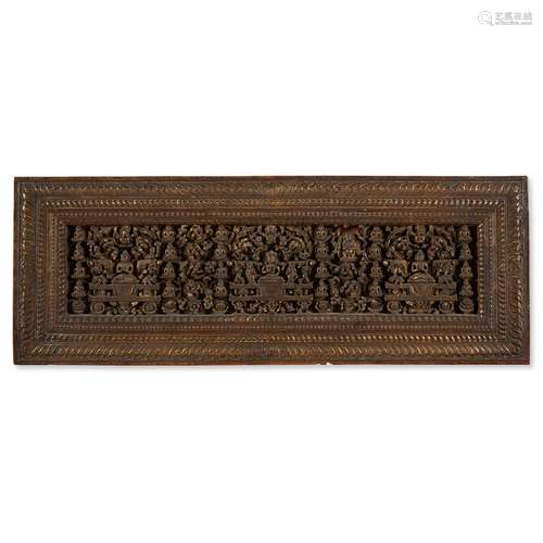 A TIBETAN CARVED GILT WOOD AND OPENWORK WOOD SUTRA COVER WITH PARCEL GILDING