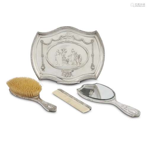 A GEORGE V STERLING SILVER FOUR PIECE DRESSING SET