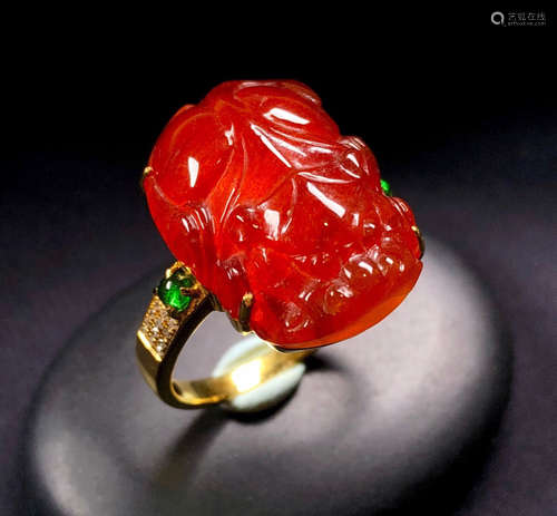 A RED JADEITE RING OF PIXIU