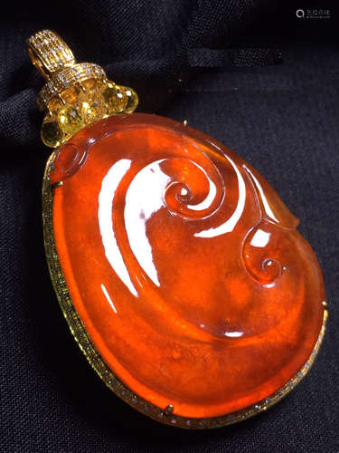 A RED JADEITE RUYI PENDANT