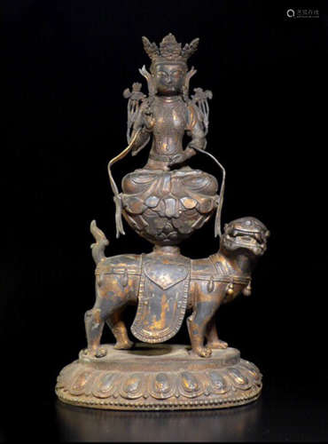 A COPPER GILT MANJUSHIRI BUDDHA ON LION