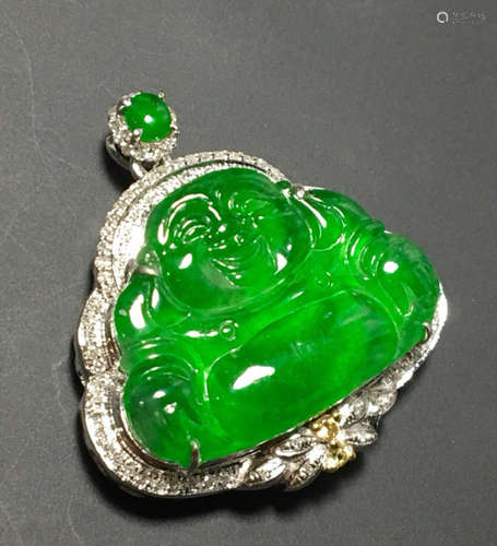 A GREEN JADEITE PENDANT OF BUDDHA