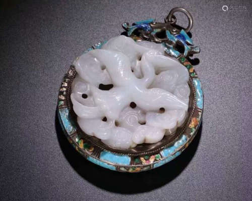 A HETIAN JADE PENDANT WRAPPED IN SILVER